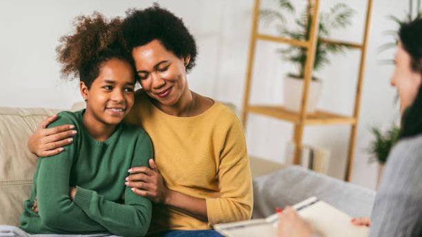Caregiver and child in a side hug